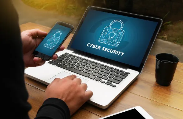 Cyber Security concept with laptop and phone