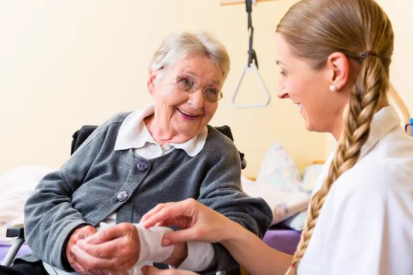 Nurse caring for senior patient