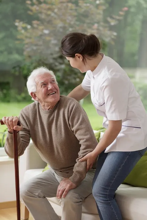 Caregiver helping elderly patient